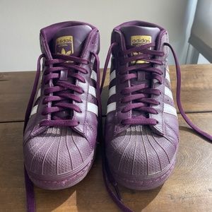 Purple Adidas high top sneakers